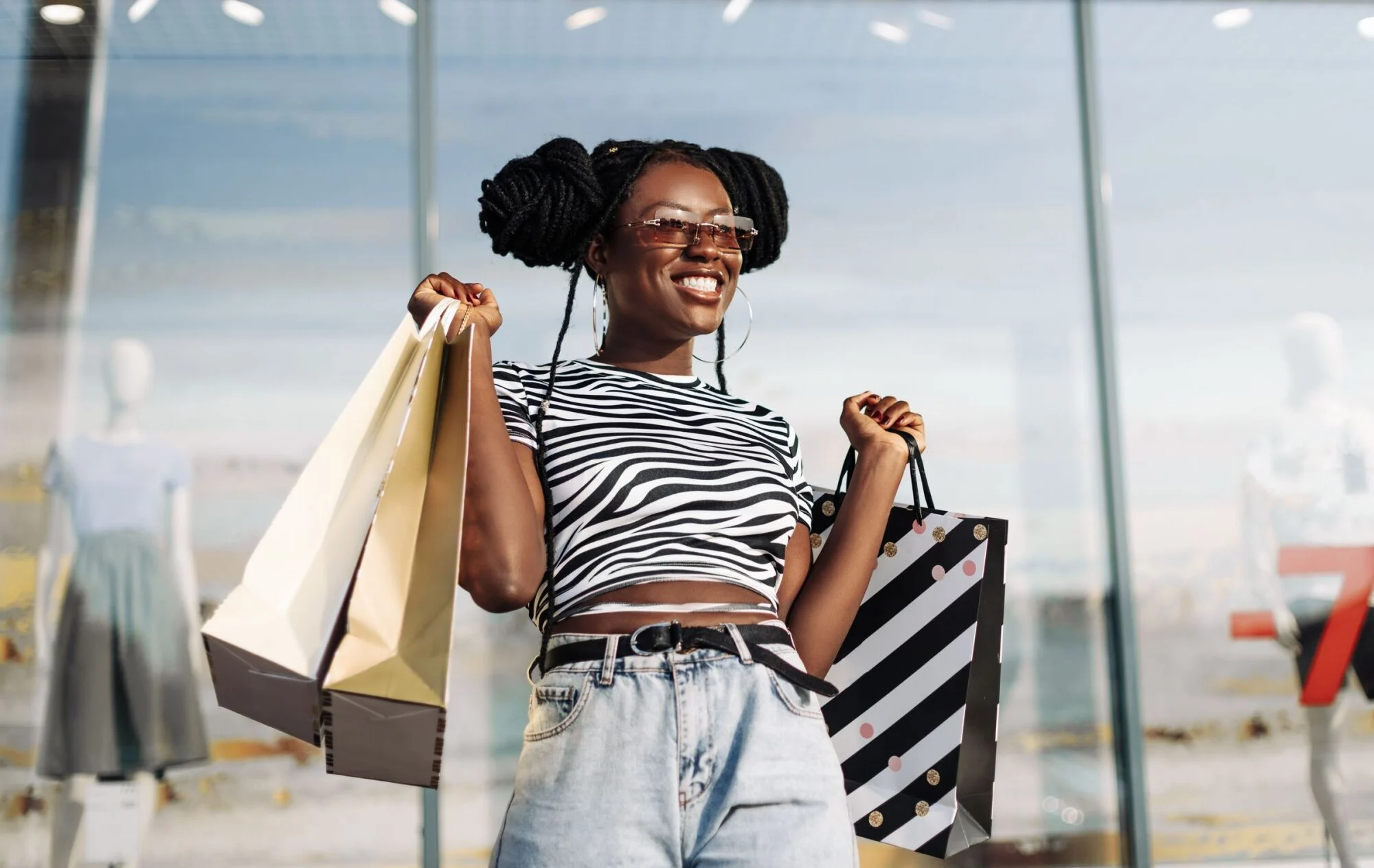 A woman holding shopping bags.